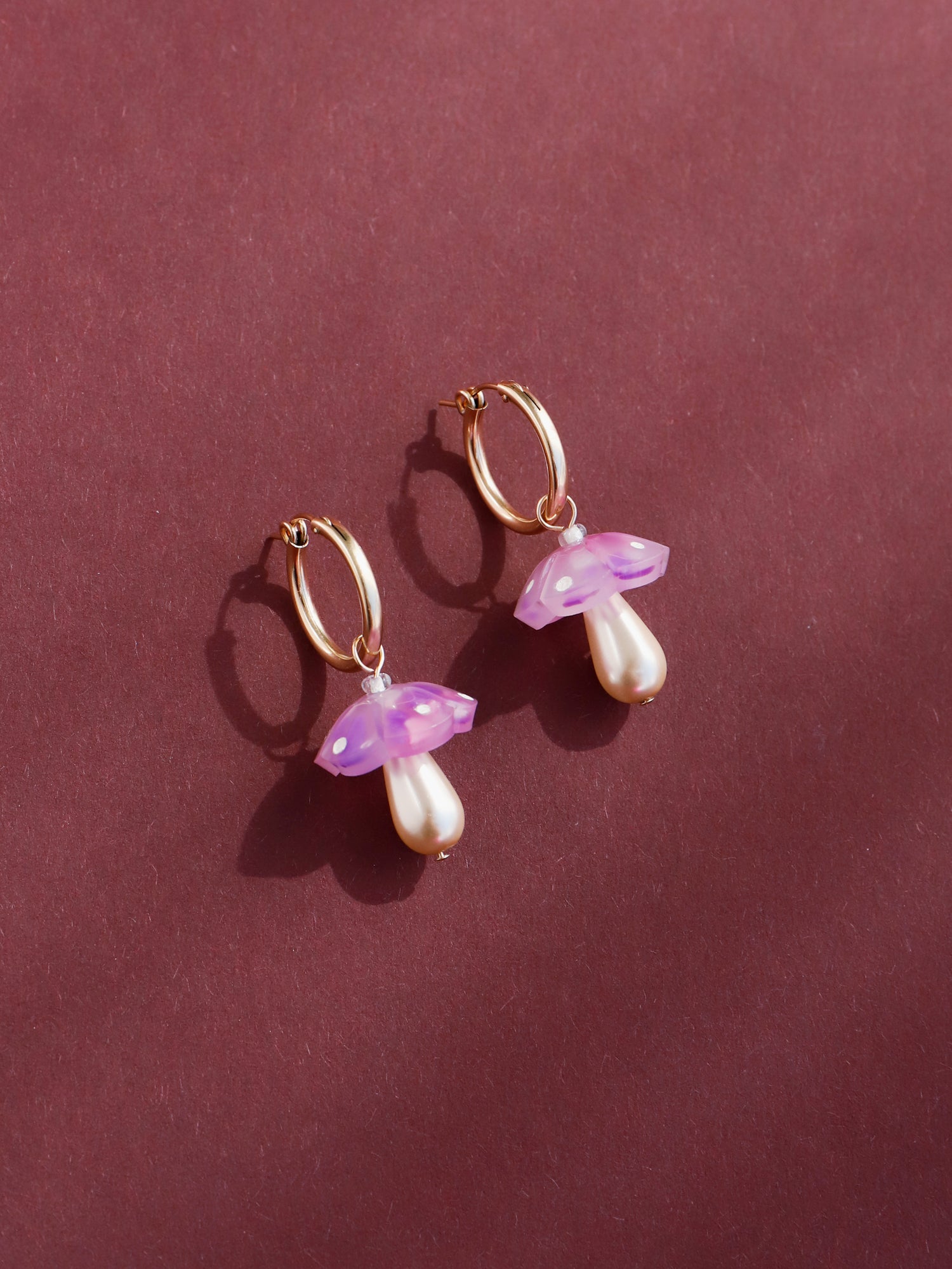 Mushroom charm hoops in lavender speckle. Made from heat-formed speckled acrylic with hand-inked details, and finished off with high quality Czech glass pearls and 14k gold-filled findings.