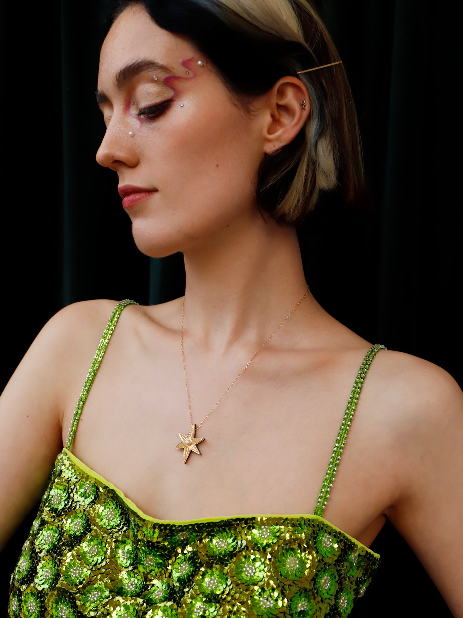Statement star necklace made with gold mirrored acrylic, embellished with glass pearls and hand inked details. Handmade in London by Wolf & Moon.