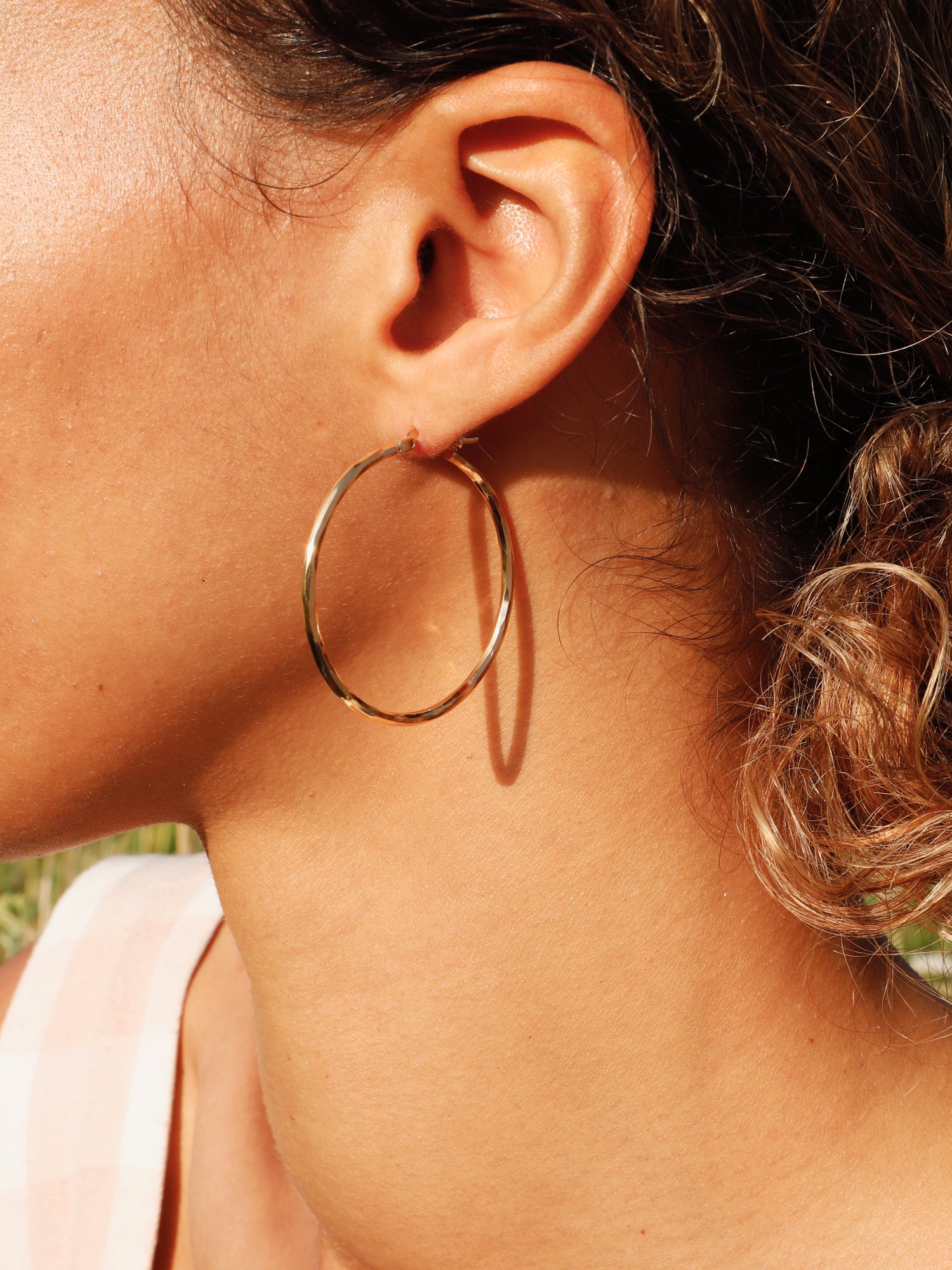 40mm hoops are made from solid brass with a very high quality 3-micron 24k gold-plating. Handmade in France, available from Wolf & Moon. 