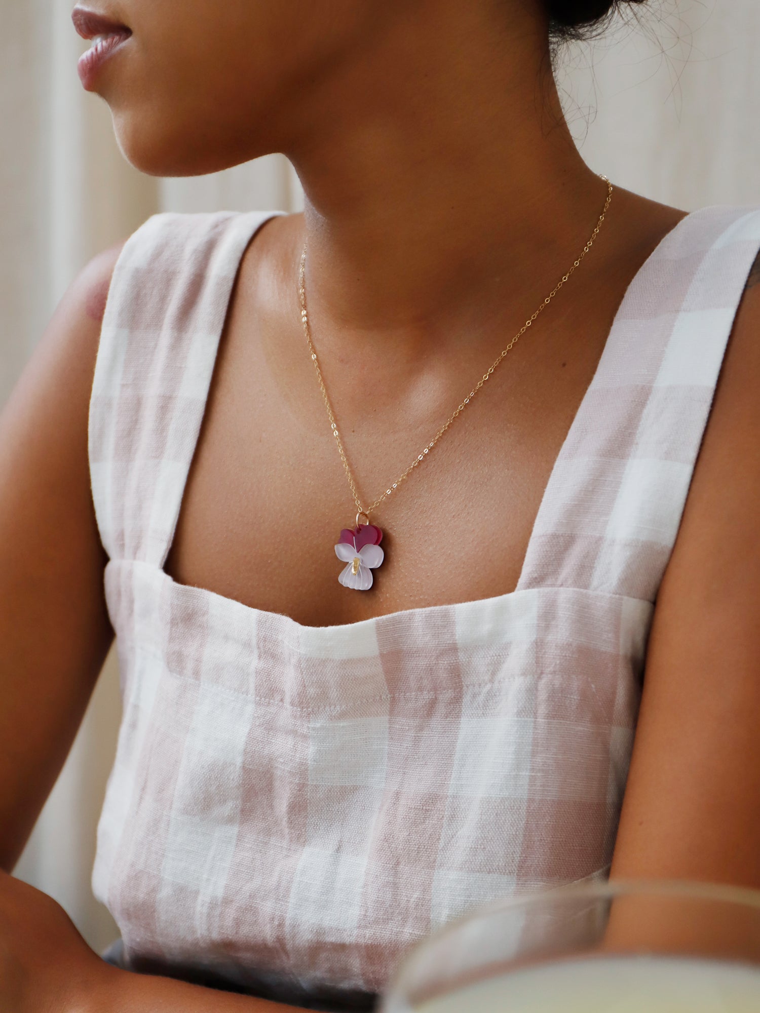 Illustrated violet flower pendant made with wood, 64% recycled acrylic and hand-inked details with 45cm 14k gold-filled chain and findings. Handmade in the UK by Wolf & Moon.
